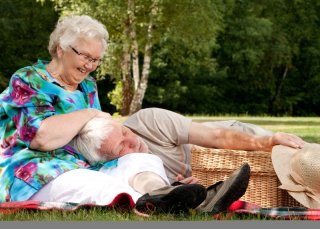 Grandmother is tickling grandfather Grandmother is tickling grandfather