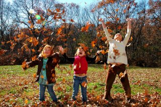 Children throwing leaves