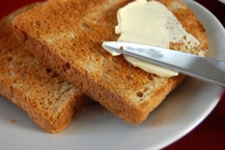 2633672-spreading-butter-with-a-knife-on-a-toast