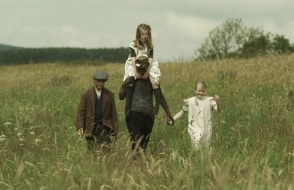 michael-with-kids-in-field-screen