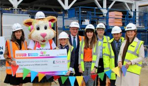 Property and construction associations build Cash for Kids - (L to R holding the cheque) Michelle Ferguson, Courage the Cat and Michelle Forth